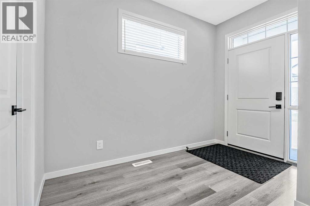 68 Wolf Gate, Okotoks, Alberta  T1S 5T9 - Photo 3 - A2329840