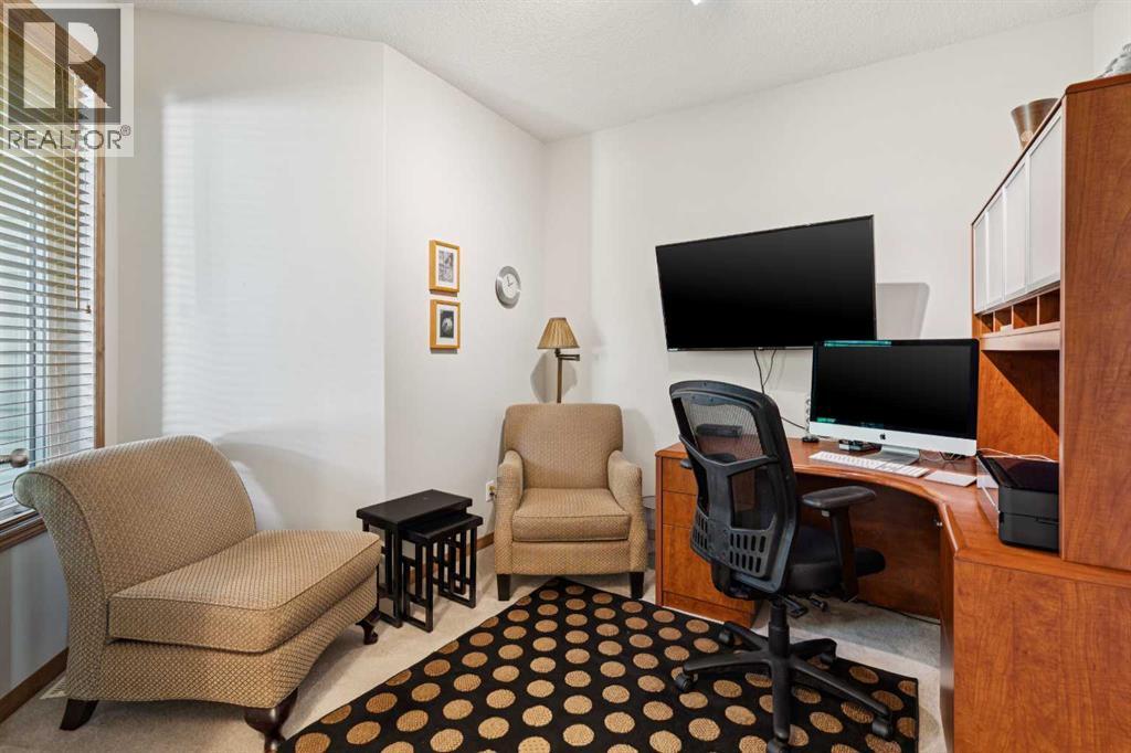 511 Rocky Ridge Drive NW, Calgary, Alberta  T3G 5C3 - Photo 3 - A2319538