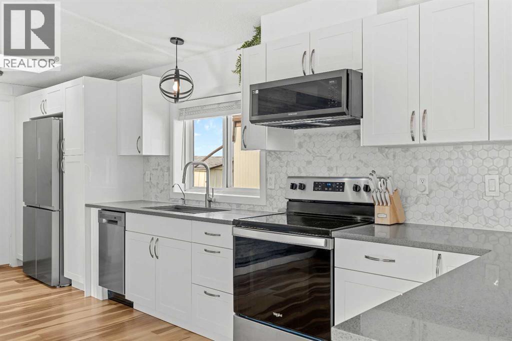 64, 1101 84 Street NE, Calgary, Alberta  T2A 7X2 - Photo 9 - A2334772
