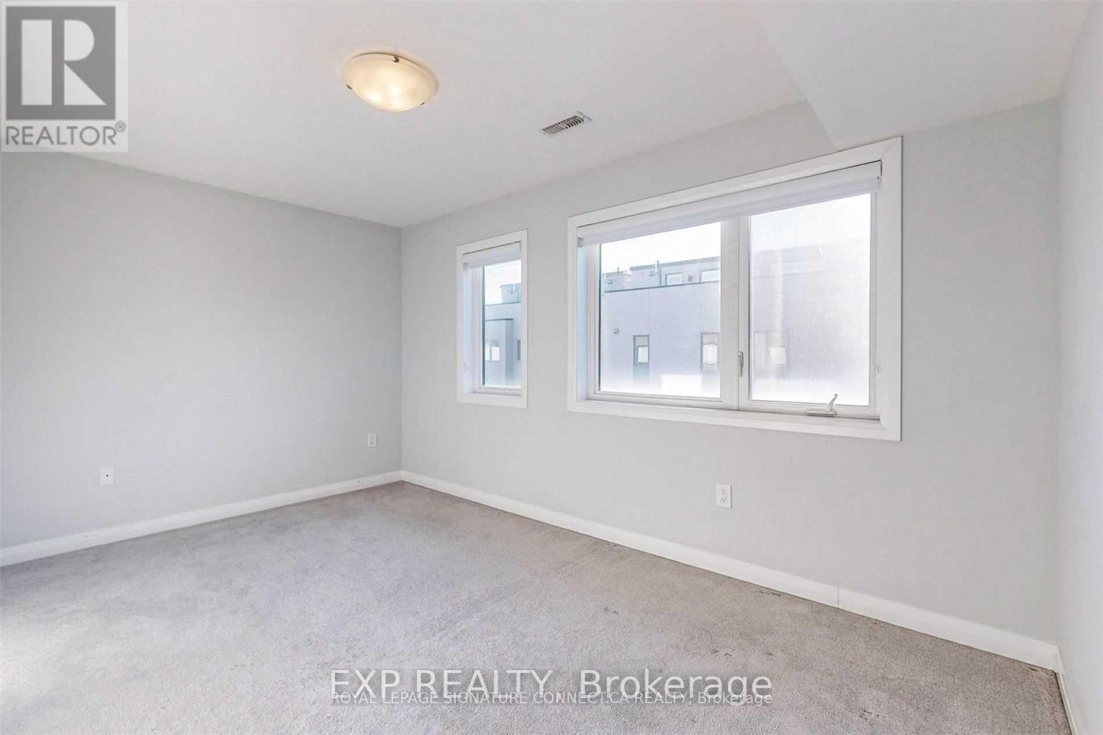 16 Caroline Carpenter Grove, Toronto, Ontario  M3K 0B1 - Photo 2 - W13654840