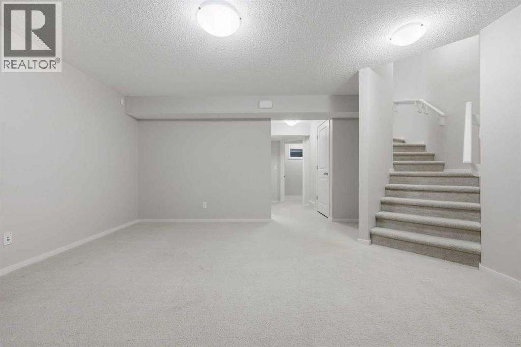 93 Sunvalley Road, Cochrane, Alberta  T4C 0X7 - Photo 33 - A2333475
