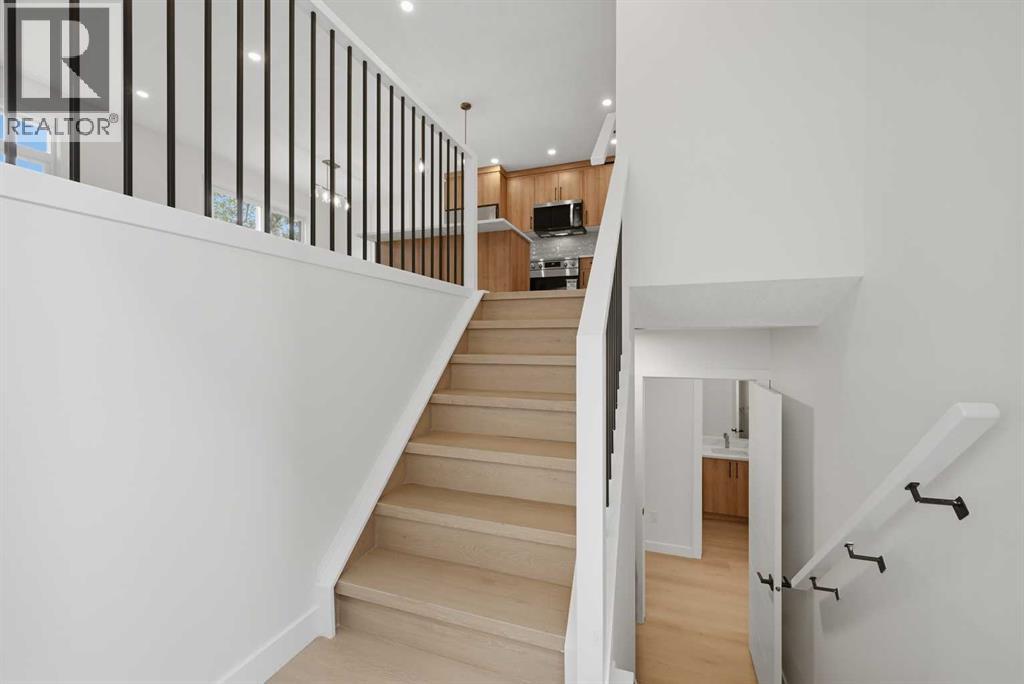 1387 Berkley Drive NW, Calgary, Alberta  T3K 1T5 - Photo 3 - A2336046