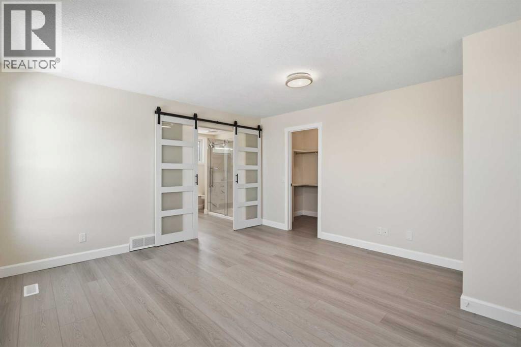 43 Beaconsfield Place NW, Calgary, Alberta  T3K 1W8 - Photo 13 - A2326961