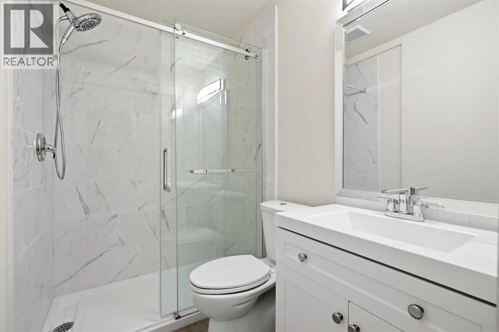43 Beaconsfield Place NW, Calgary, Alberta  T3K 1W8 - Photo 30 - A2326961
