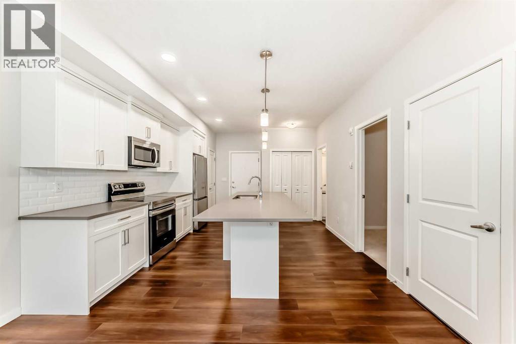 104, 360 Harvest Hills Common NE, Calgary, Alberta  T3K 2N1 - Photo 6 - A2283549