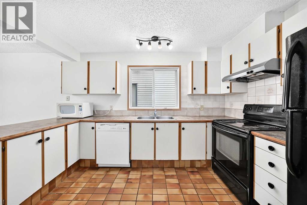 454 20 Avenue NW, Calgary, Alberta  T2M 1C4 - Photo 5 - A2322620