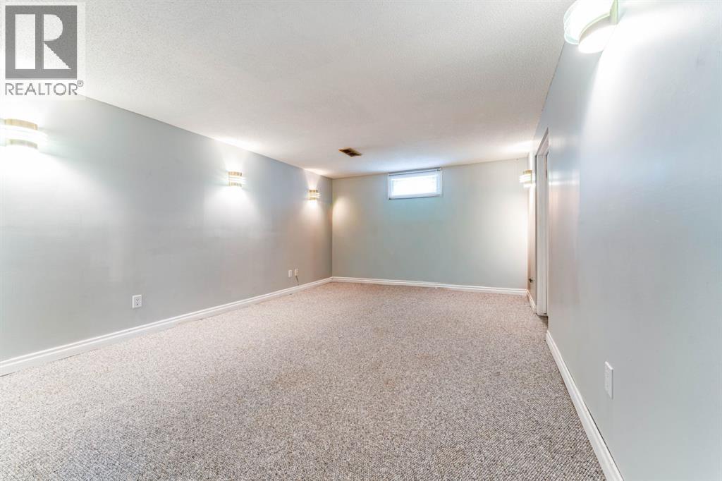 7511 Huntridge Crescent Ne, Calgary, Alberta  T2K 4C8 - Photo 29 - A2323516