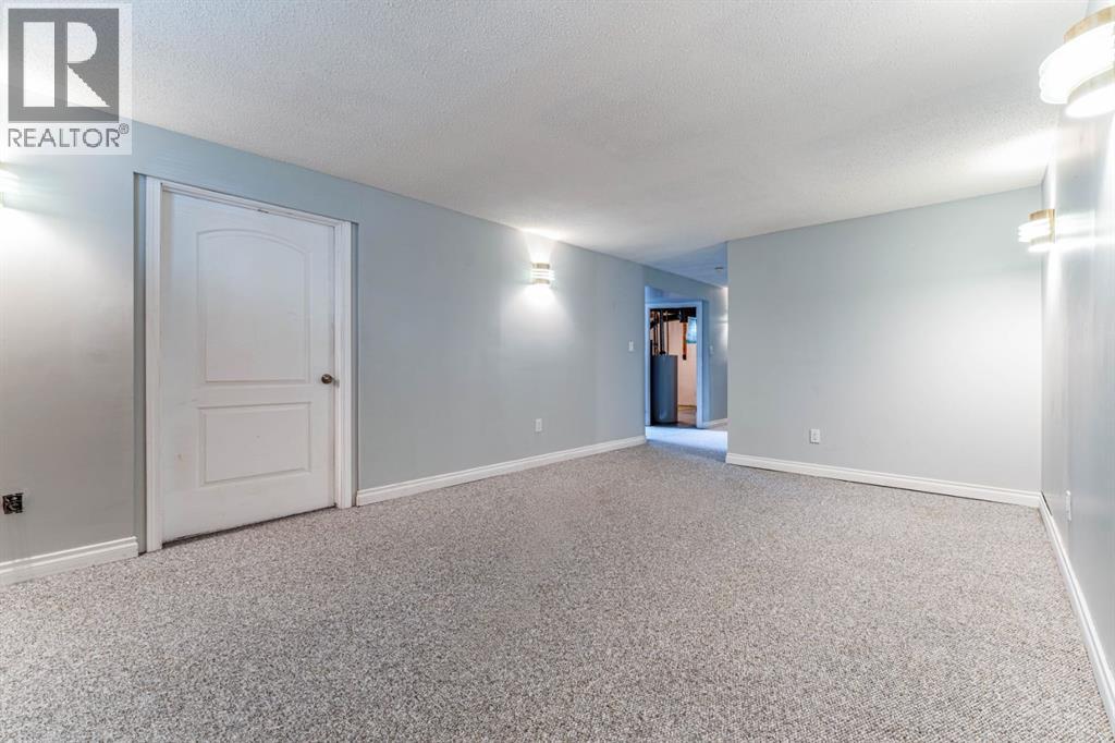 7511 Huntridge Crescent Ne, Calgary, Alberta  T2K 4C8 - Photo 34 - A2323516