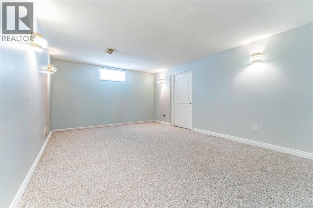 7511 Huntridge Crescent Ne, Calgary, Alberta  T2K 4C8 - Photo 28 - A2323516