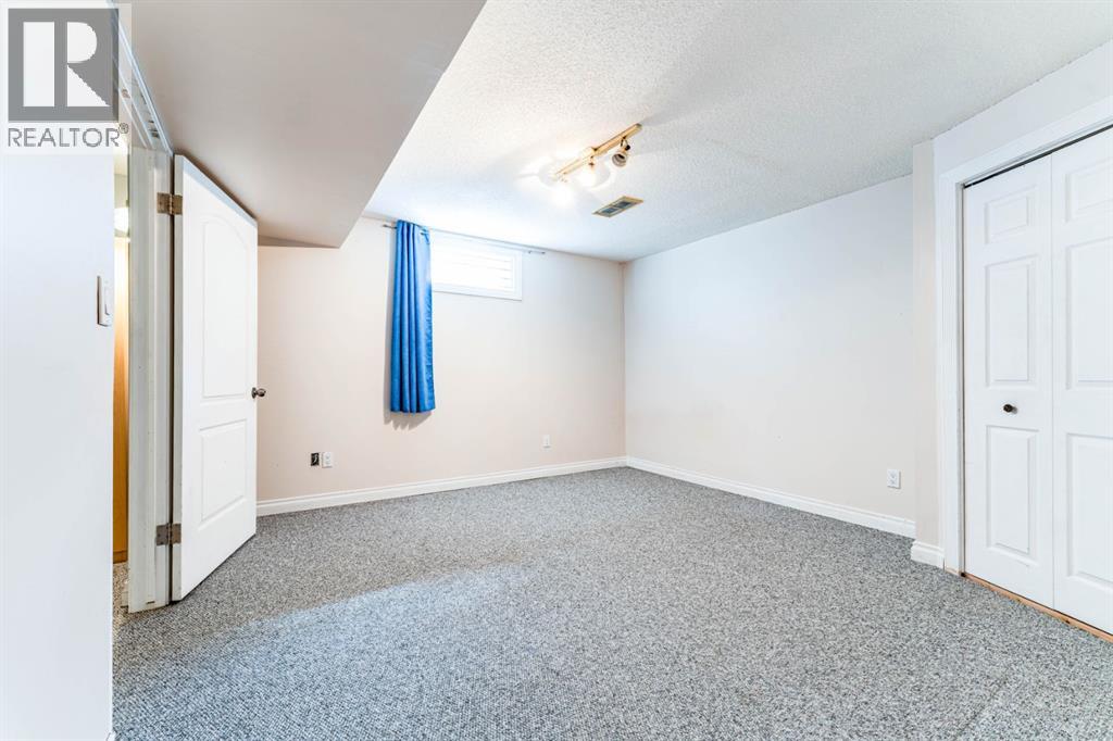 7511 Huntridge Crescent Ne, Calgary, Alberta  T2K 4C8 - Photo 32 - A2323516