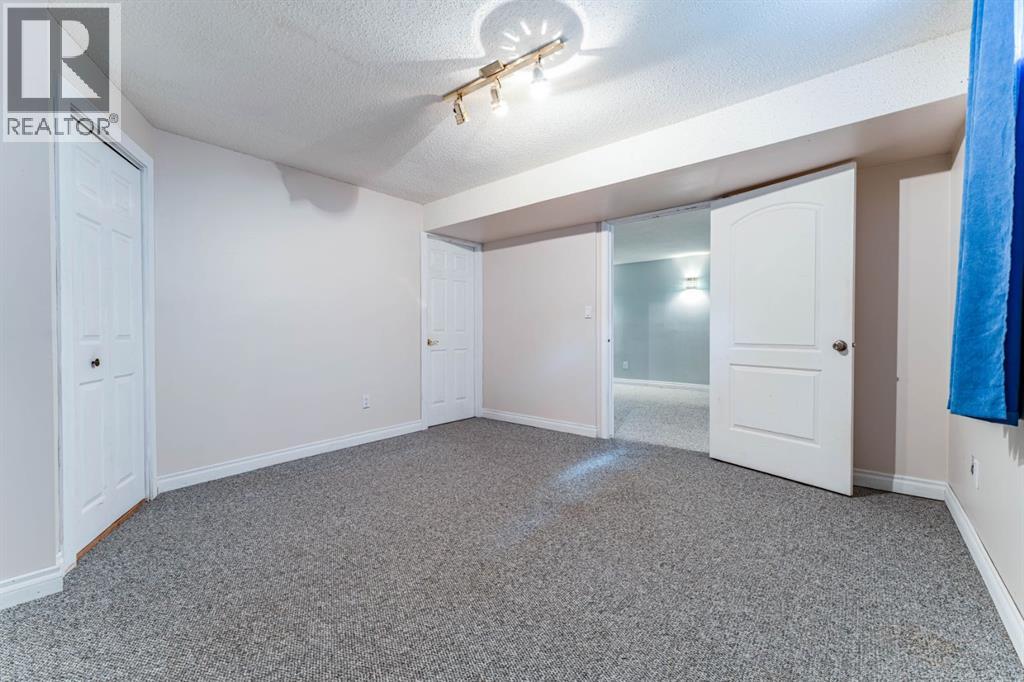 7511 Huntridge Crescent Ne, Calgary, Alberta  T2K 4C8 - Photo 33 - A2323516
