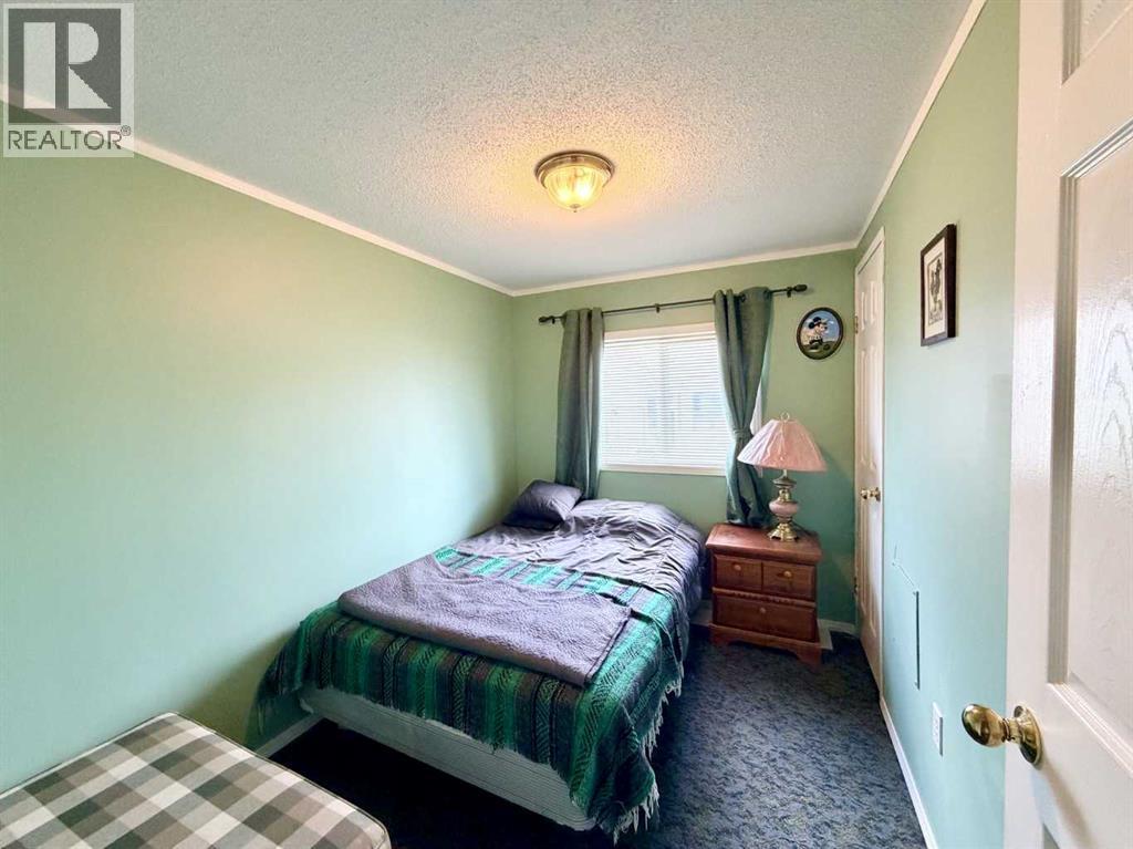 406 Picci Court, Linden, Alberta  T0M 1J0 - Photo 8 - A2336284