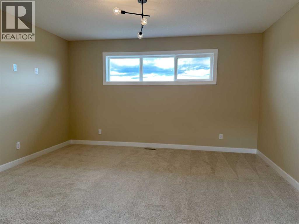 147 Sundown Crescent, Cochrane, Alberta  T4C 1Y3 - Photo 28 - A2312374