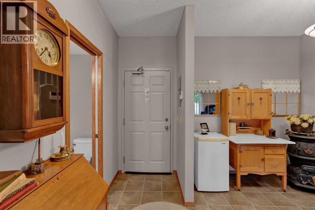 115, 72 Quigley Drive, Cochrane, Alberta  T4C 2K6 - Photo 10 - A2335665