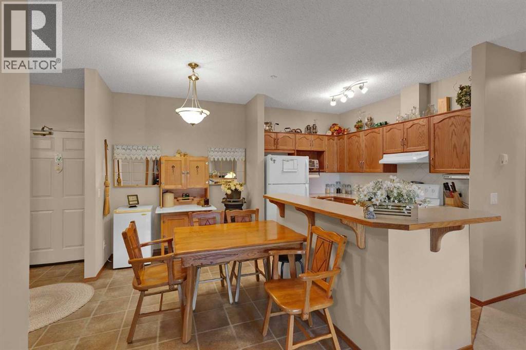 115, 72 Quigley Drive, Cochrane, Alberta  T4C 2K6 - Photo 30 - A2335665