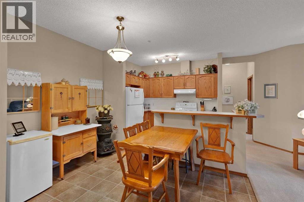 115, 72 Quigley Drive, Cochrane, Alberta  T4C 2K6 - Photo 9 - A2335665