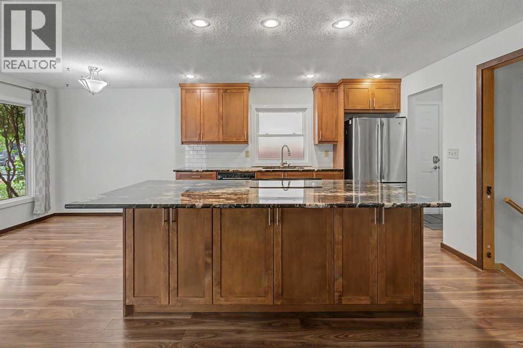 115 Mckenna Crescent SE, Calgary, Alberta  T2Y 1Y2 - Photo 6 - A2336059