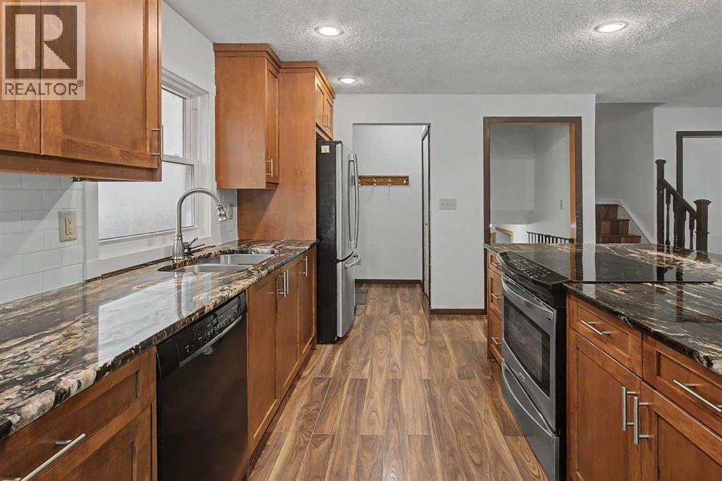 115 Mckenna Crescent SE, Calgary, Alberta  T2Y 1Y2 - Photo 9 - A2336059