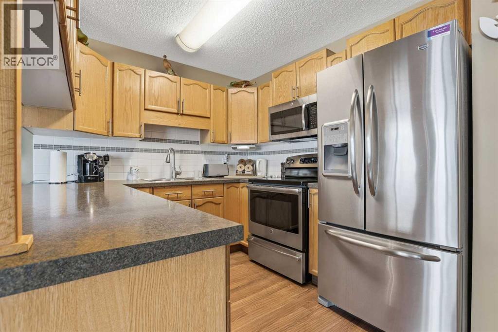 11 Macewan Park Heights NW, Calgary, Alberta  T3K 3W6 - Photo 12 - A2316477