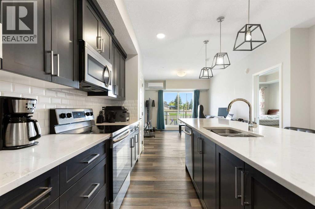 201, 300 Harvest Hills Place Ne, Calgary, Alberta  T3K 2P4 - Photo 6 - A2313543