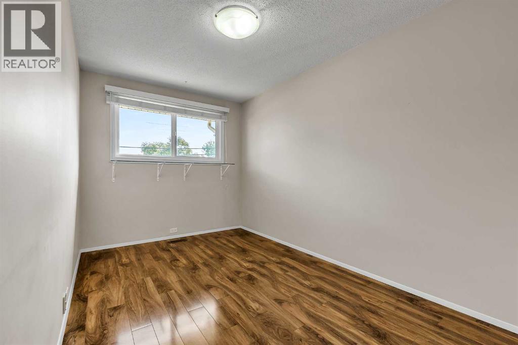 99 Huntford Road Ne, Calgary, Alberta  T2K 3Z1 - Photo 16 - A2317231