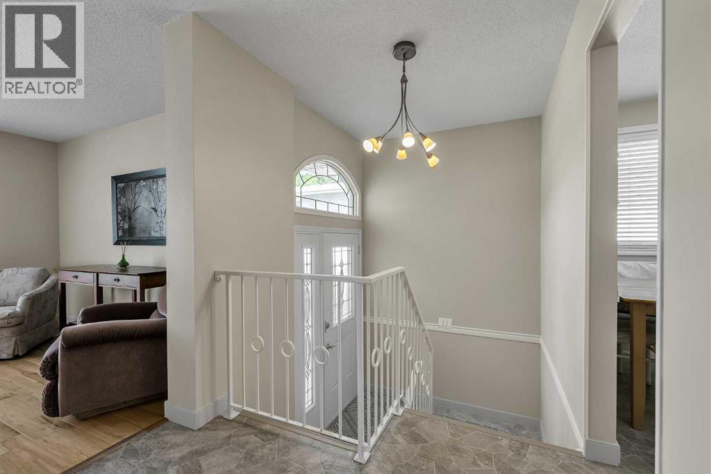 99 Huntford Road Ne, Calgary, Alberta  T2K 3Z1 - Photo 3 - A2317231