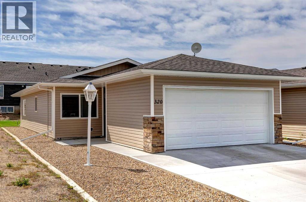 320 Whispering Way, Vulcan, Alberta  T0L 2B0 - Photo 1 - A2331029
