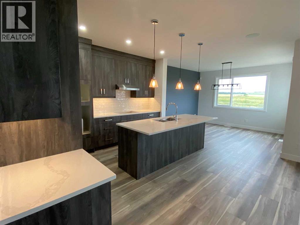 1409 Aldrich Place SW, Carstairs, Alberta  T0M 0N0 - Photo 3 - A2337436