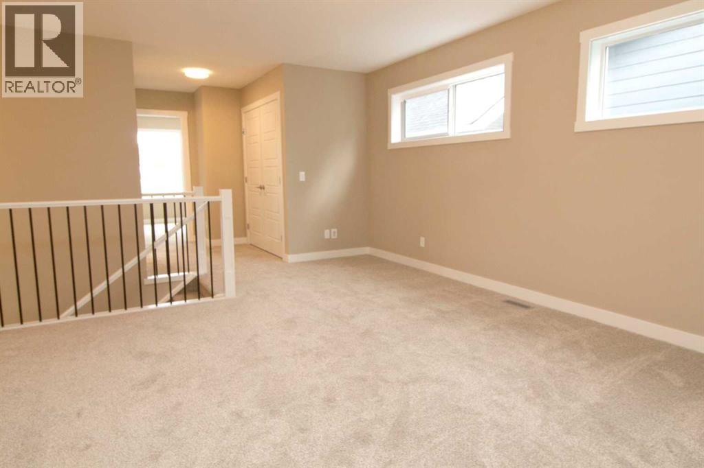 115 Sundown Crescent, Cochrane, Alberta  T4C 1Y3 - Photo 18 - A2297377