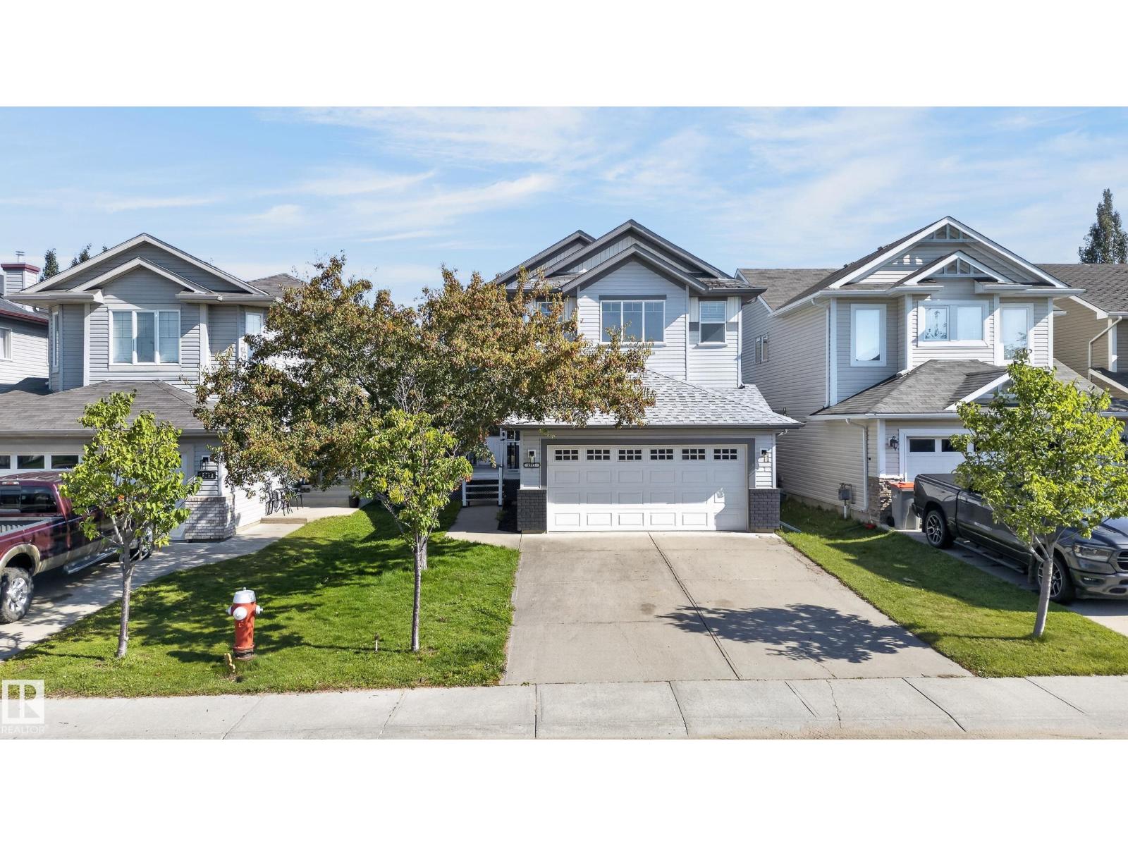 Okay, Here’s the Deal! Freshly painted top to bottom, this fully finished 2-storey home in Stony Plain’s desirable Westerra community is ready for you to move right in! From the moment you step into the expansive foyer, you’ll love the open, bright feel. The heart of the home is an open-concept great room anchored by a standout live edge island kitchen and a cozy fireplace family room. Step outside to your private backyard with a large deck—perfect for outdoor entertaining and summer relaxing! Upstairs features a massive bonus room plus four generous bedrooms, including a spacious primary retreat with a full soaker tub ensuite. Need flex space or secondary living? A separate entrance directly off the double attached garage leads to a fully finished basement complete with a second kitchen/bar area, 4th full bath, extra bedroom space, and theatre room! Central A/C included—this Westerra gem truly has it all! (id:48254)