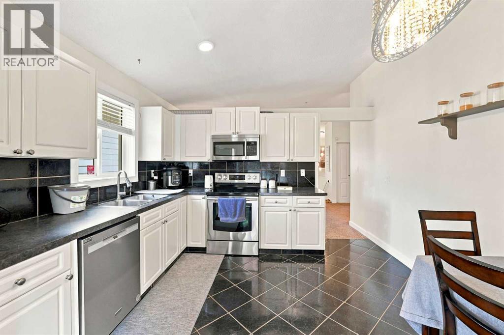 225 Harvest Glen Place NE, Calgary, Alberta  T3K 4J1 - Photo 7 - A2330527