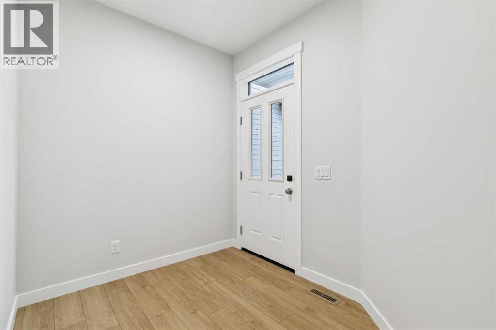 97 Creekstone Hill SW, Calgary, Alberta  T2X 5G3 - Photo 4 - A2306344
