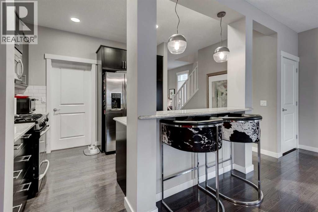 78 Ypres Green SW, Calgary, Alberta  T2T 6M1 - Photo 9 - A2316254