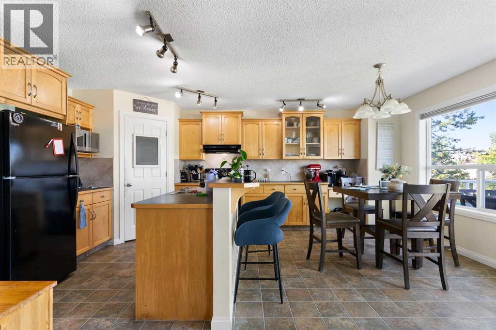 151 Bow Ridge Crescent, Cochrane, Alberta  T4C 1V2 - Photo 11 - A2327661