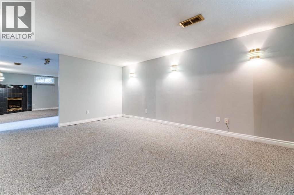 7511 Huntridge Crescent Ne, Calgary, Alberta  T2K 4C8 - Photo 30 - A2323516