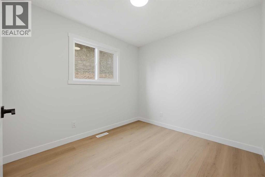 1387 Berkley Drive NW, Calgary, Alberta  T3K 1T5 - Photo 29 - A2336046