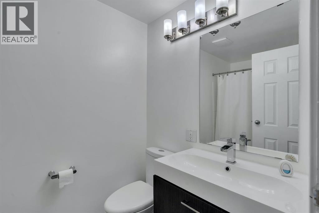 174 Woodmont Terrace SW, Calgary, Alberta T2W 4Z4 - Photo 10 - A2338075