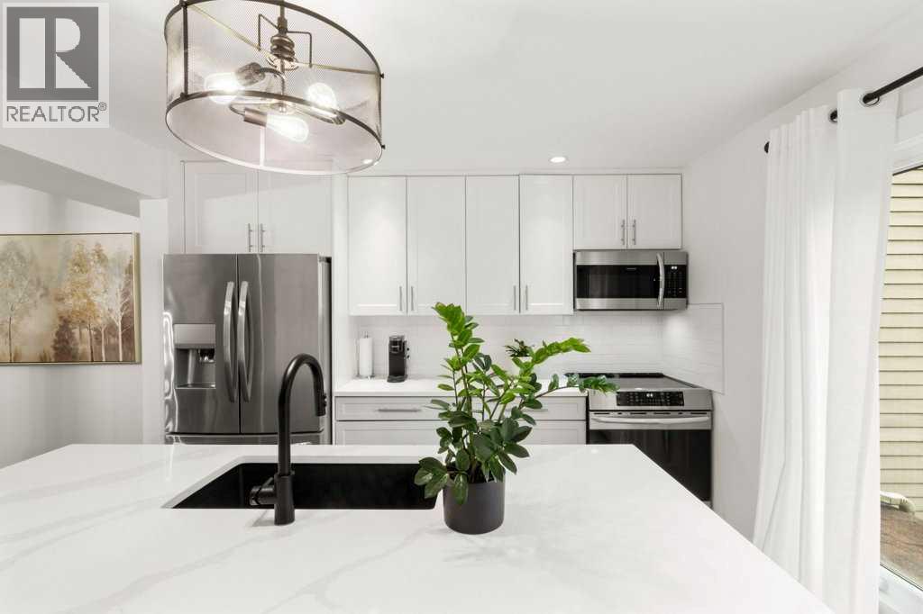 3909 Point Mckay Road NW, Calgary, Alberta T3B 4V7 - Photo 11 - A2337197