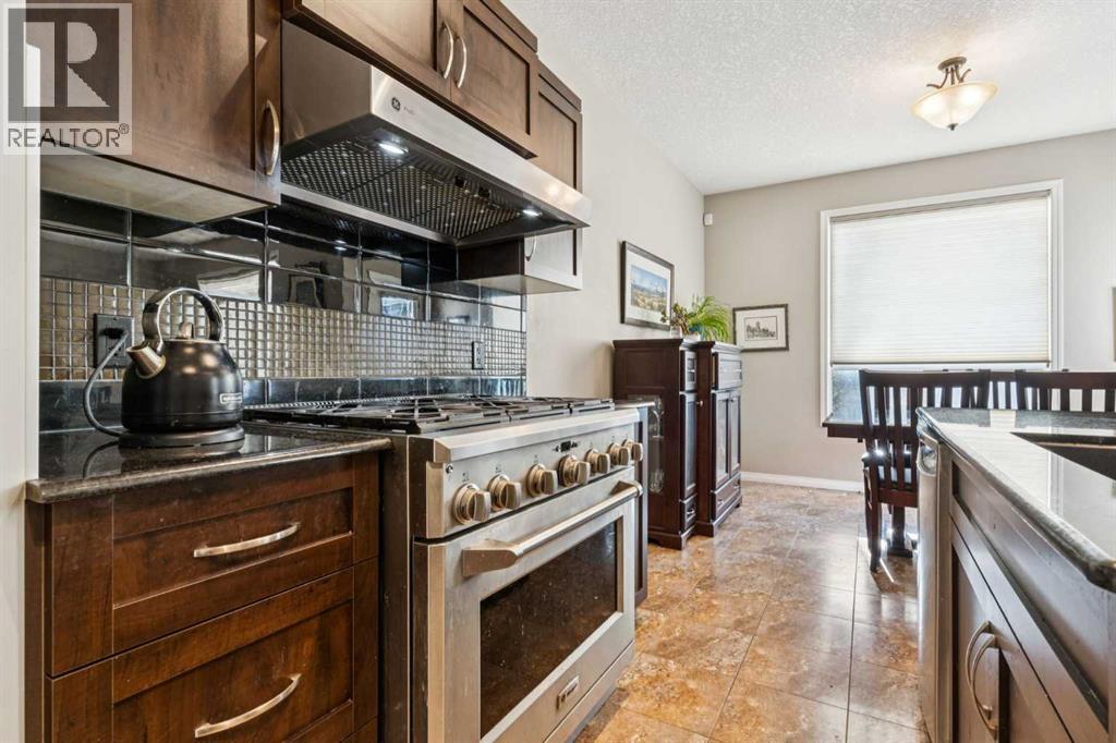 645 Panatella Boulevard NW, Calgary, Alberta  T3K 0N9 - Photo 4 - A2330896