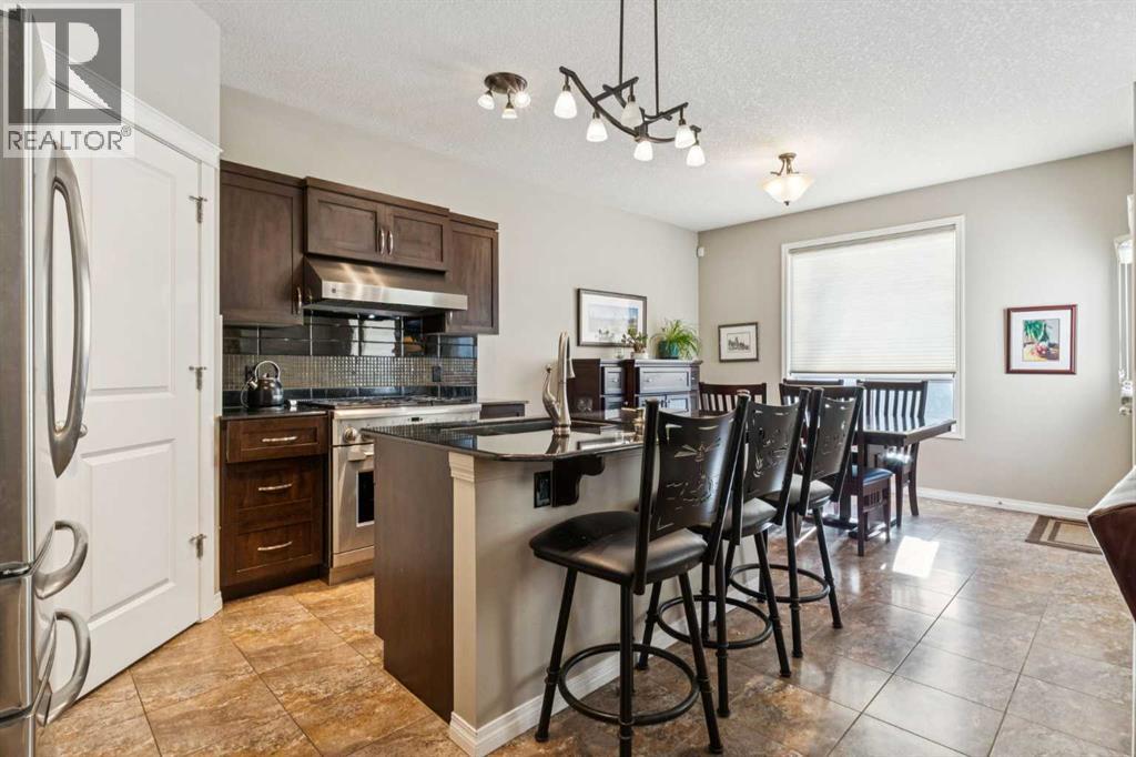 645 Panatella Boulevard NW, Calgary, Alberta  T3K 0N9 - Photo 3 - A2330896