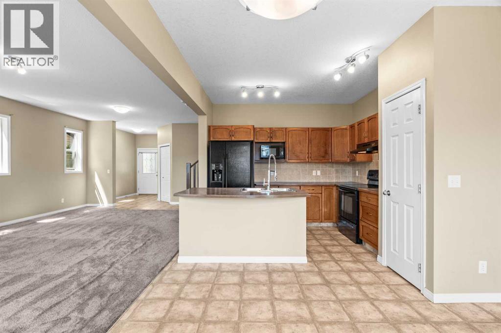 391 Cimarron Boulevard, Okotoks, Alberta  T1S 0A9 - Photo 15 - A2320761