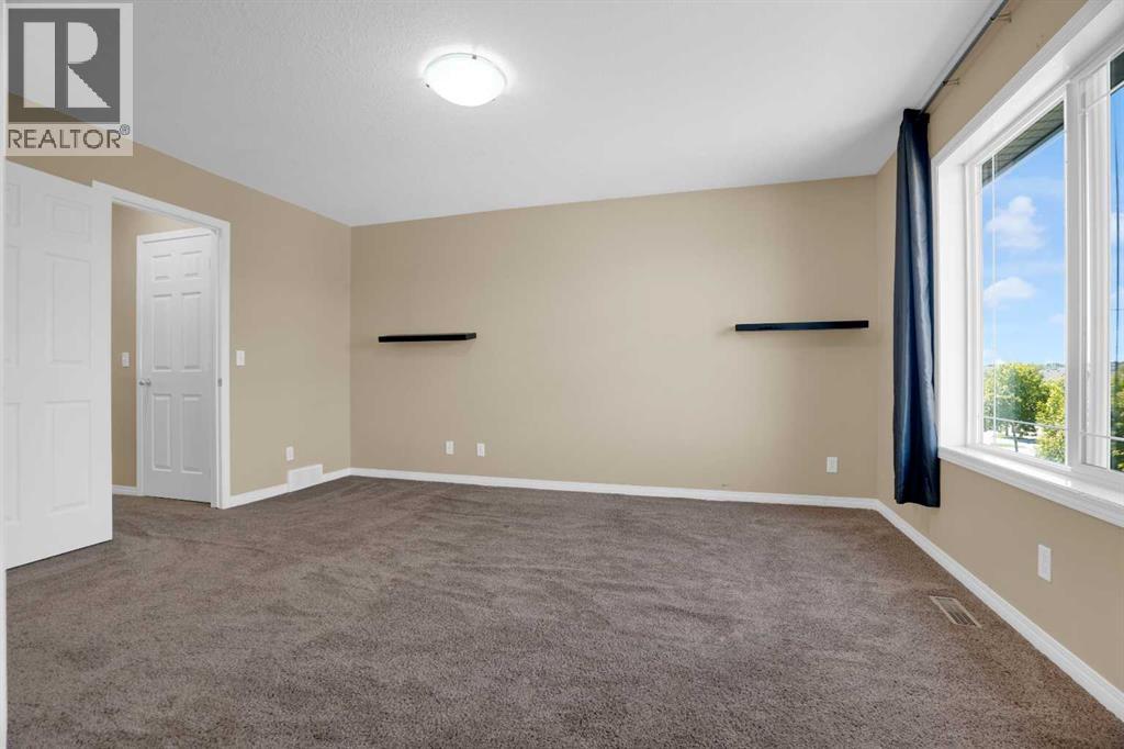 391 Cimarron Boulevard, Okotoks, Alberta  T1S 0A9 - Photo 28 - A2320761