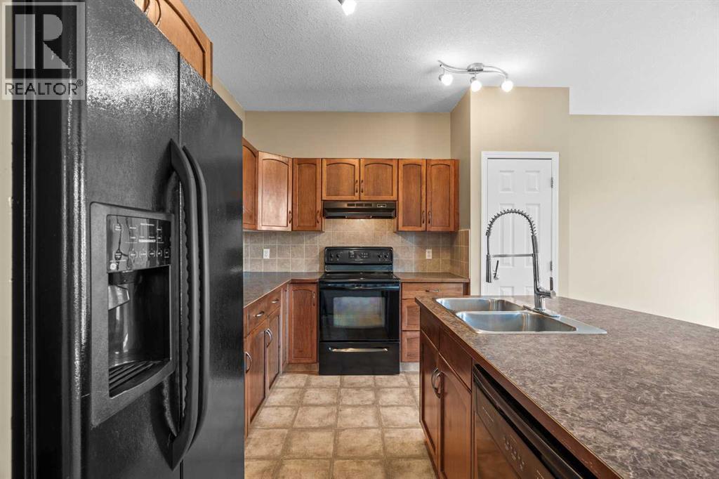 391 Cimarron Boulevard, Okotoks, Alberta  T1S 0A9 - Photo 6 - A2320761