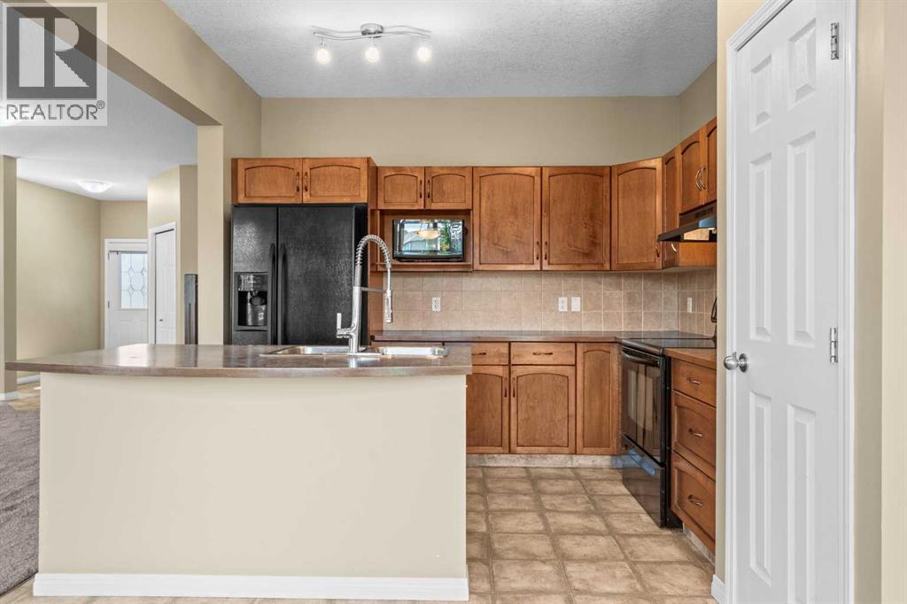 391 Cimarron Boulevard, Okotoks, Alberta  T1S 0A9 - Photo 16 - A2320761