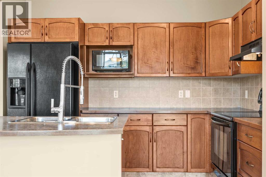 391 Cimarron Boulevard, Okotoks, Alberta  T1S 0A9 - Photo 9 - A2320761