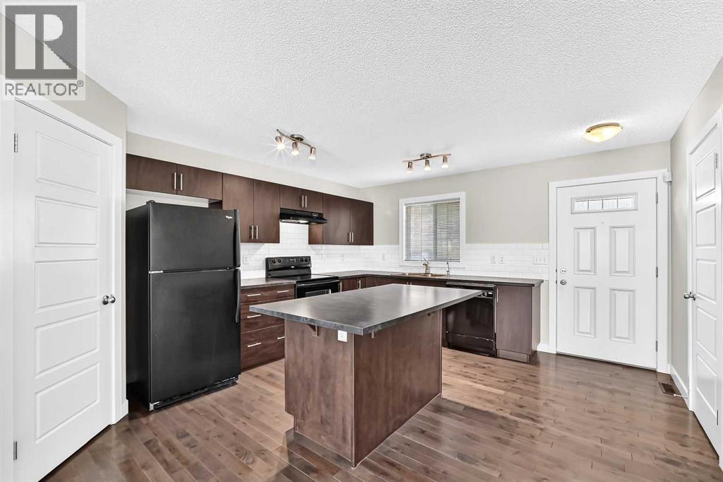 152 Pantego Lane NW, Calgary, Alberta  T3K 0T1 - Photo 5 - A2338088