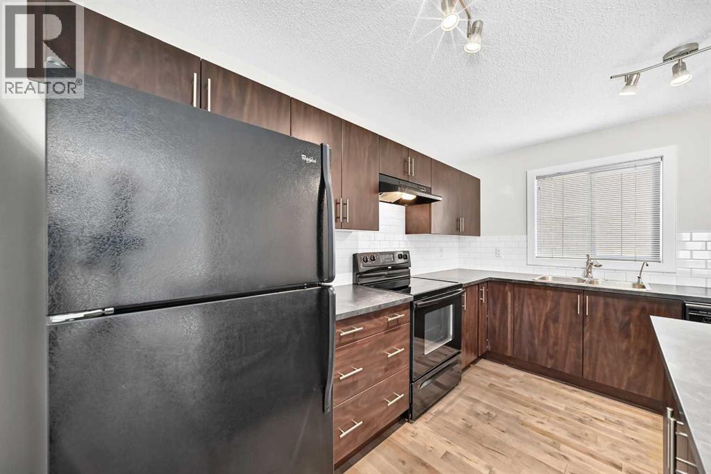 152 Pantego Lane NW, Calgary, Alberta  T3K 0T1 - Photo 7 - A2338088