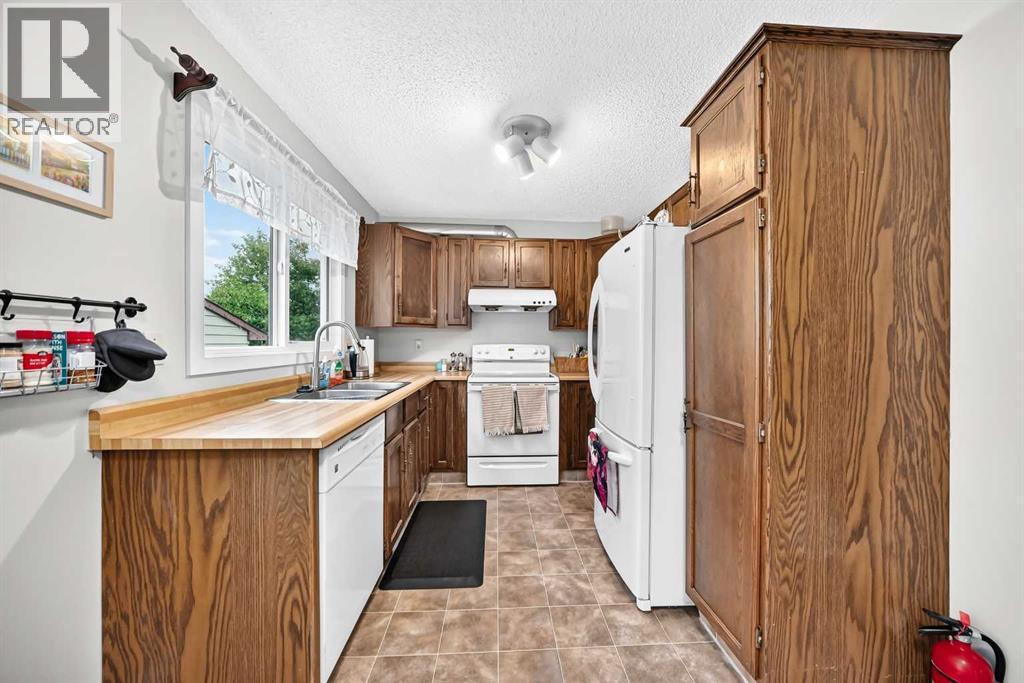 1487 Berkley Drive NW, Calgary, Alberta  T3K 1T7 - Photo 17 - A2337862
