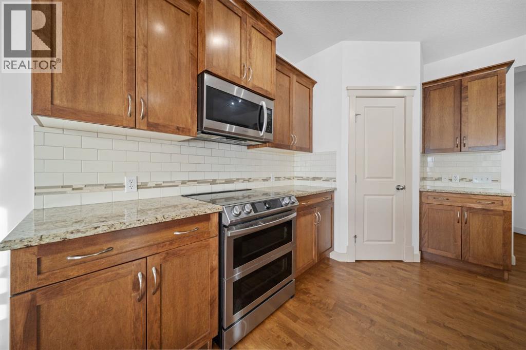141 Crystal Green Drive, Okotoks, Alberta  T1S 0C8 - Photo 10 - A2338676