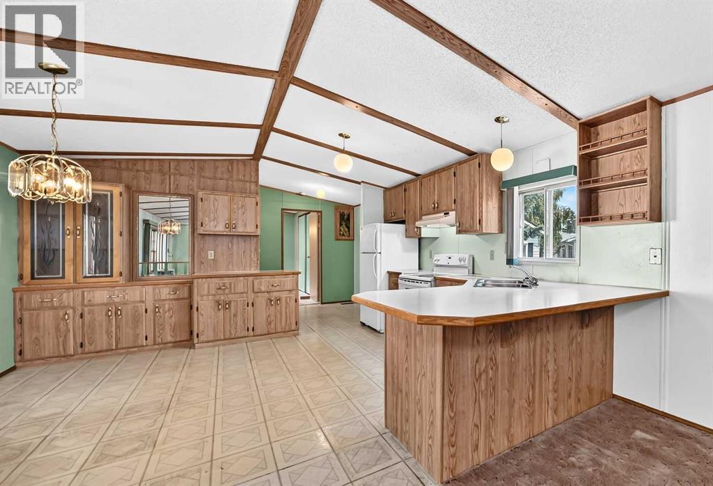3218 Burroughs Manor NE, Calgary, Alberta  T1Y 6K2 - Photo 6 - A2328136